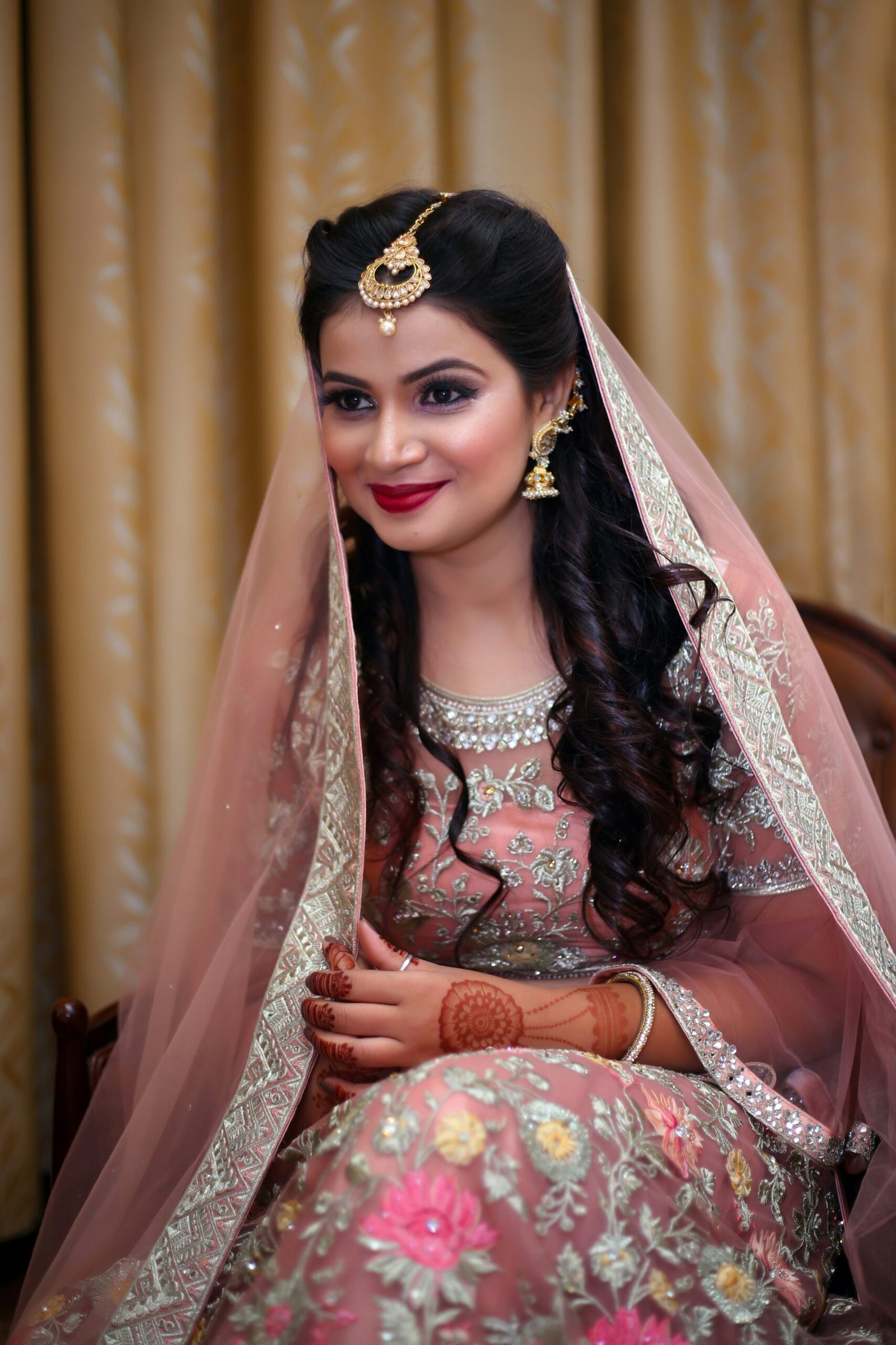 woman in white and red floral dress wearing gold crown